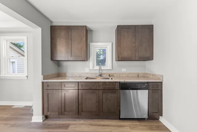 a kitchen with a sink and cabinets