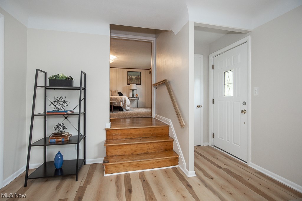 3762 Covington Road South Euclid, OH 44121 - Photo 11 of 31 Entryway with light wood-style floors and stairs