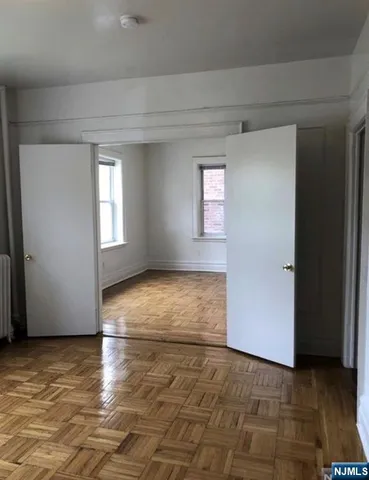 a view of an empty room and window
