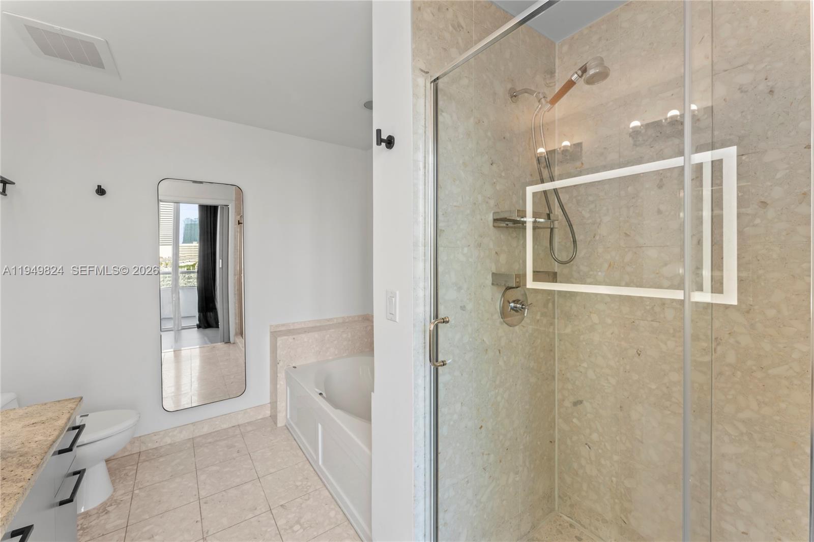 185 Southwest 7th Street, Unit 603 Miami, FL 33130 - Photo 21 of 32 a bathroom with a shower