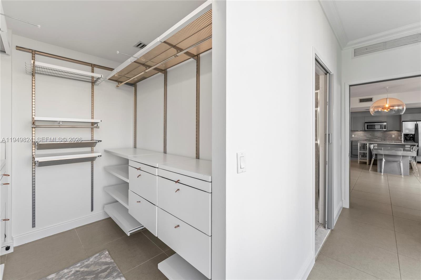 185 Southwest 7th Street, Unit 603 Miami, FL 33130 - Photo 27 of 32 a view of cabinets and wooden floor