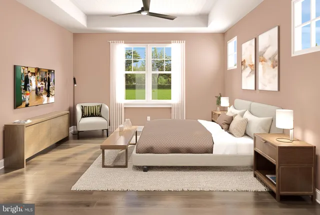 a living room with a bed furniture and a window