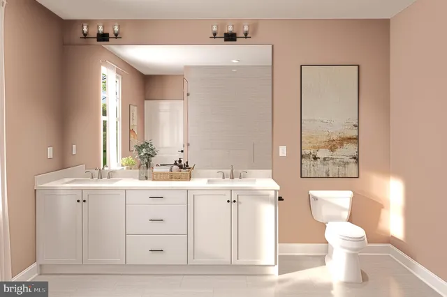 a bedroom with a large bed and a potted plant