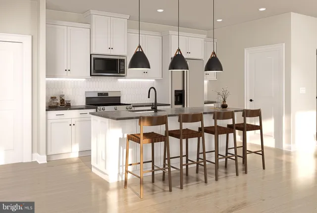 a kitchen with stainless steel appliances kitchen island granite countertop a stove a sink a dining table and chairs with wooden floor