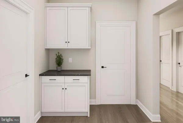 a view of cabinets with wooden floor
