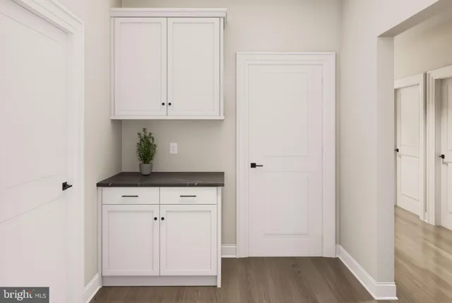 a view of cabinets with wooden floor