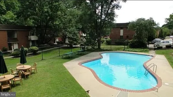 a view of a swimming pool with a patio