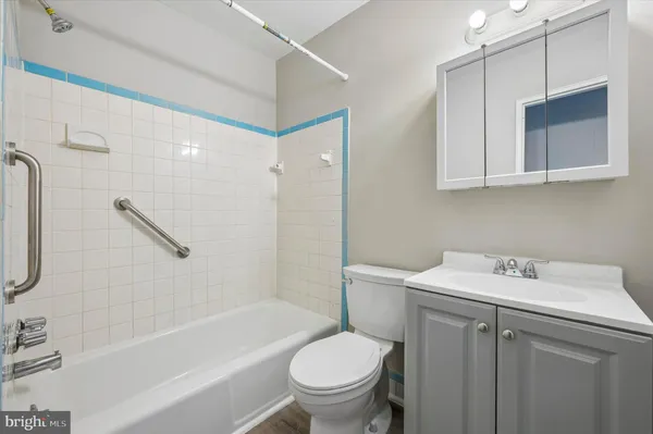 a bathroom with a sink a toilet and a bathtub