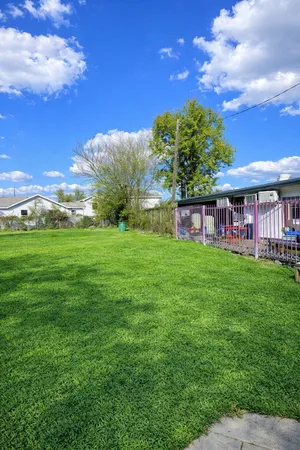 a view of a house with a big yard
