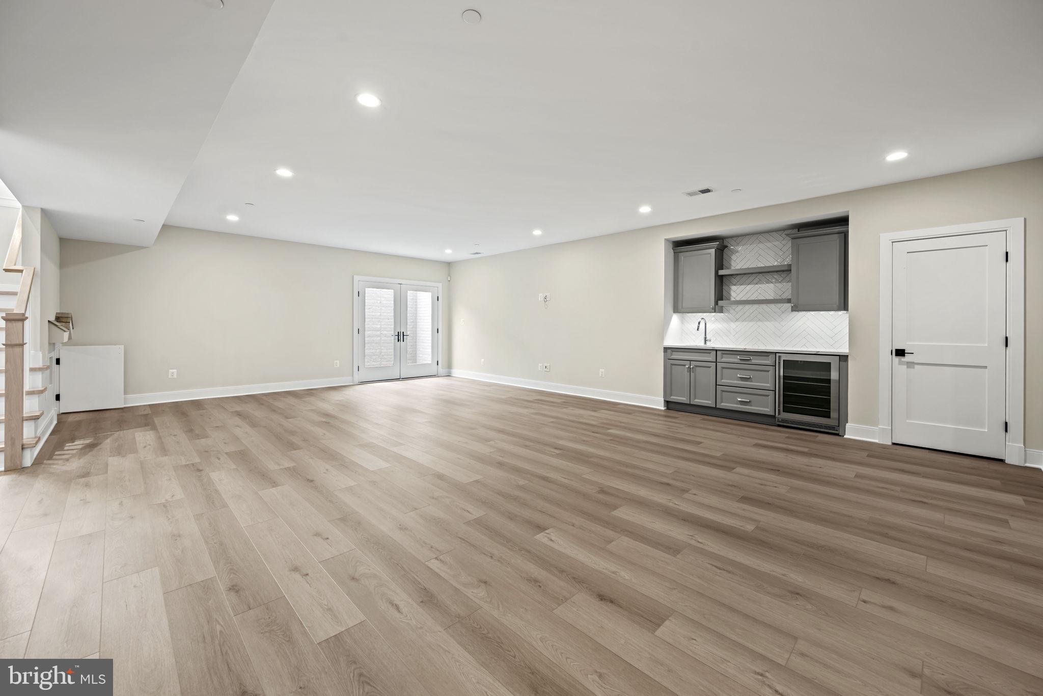 8911 Ewing Drive Bethesda, MD 20817 - Photo 50 of 67 Recreation Room with Wet Bar. Side Yard Exit