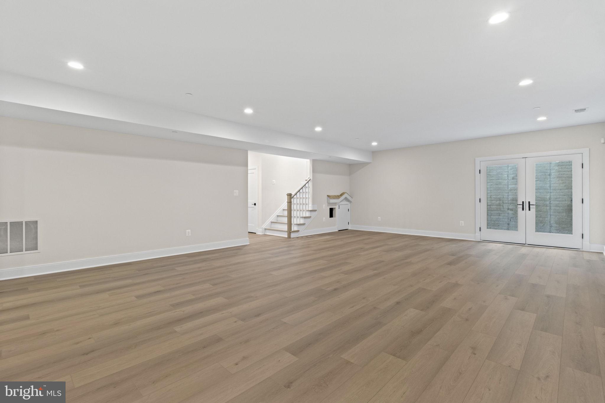 8911 Ewing Drive Bethesda, MD 20817 - Photo 54 of 67 Recreation Room and Side Yard Stair Exit