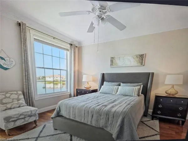 a bedroom with a large bed and a window