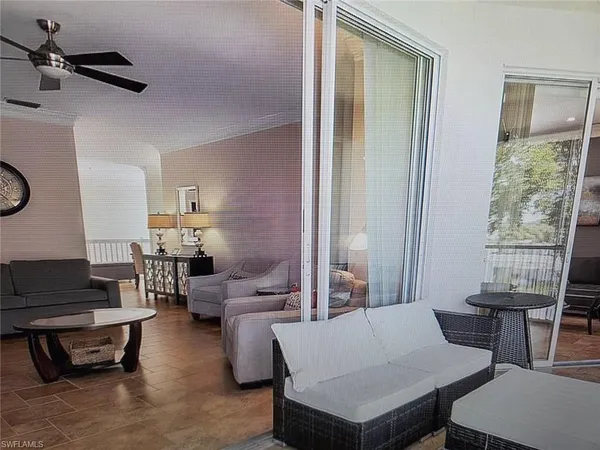 a picture of a room with a bed and a potted plant