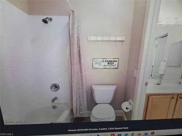 an aerial view of a house with swimming pool patio and outdoor seating