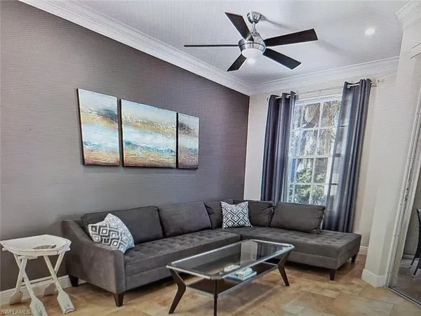 a living room with furniture and a window