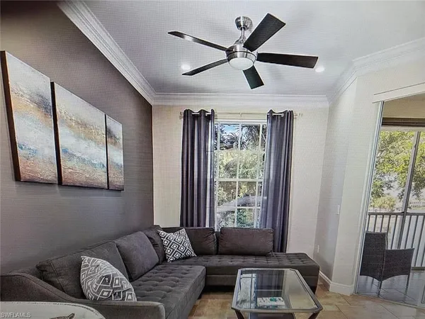 a living room with furniture and a window