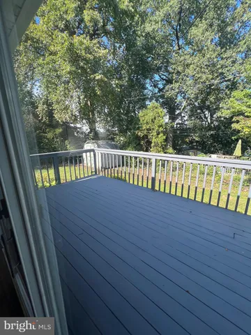 a view of balcony with wooden floor