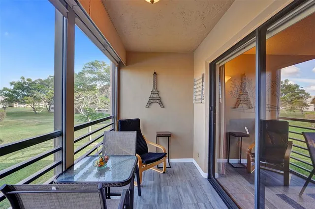 a kitchen with kitchen island a stove a sink and a refrigerator with cabinets