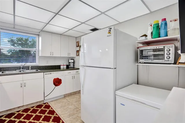 a view of a hallway with washer and dryer