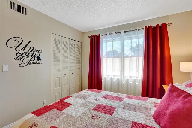 a bathroom with a sink toilet and mirror