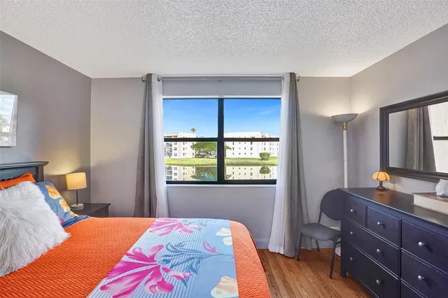 a view of a porch with furniture and a yard