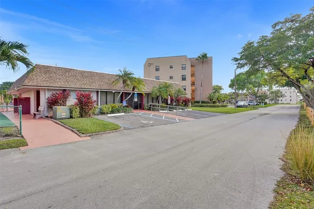 a view of a swimming pool with a yard