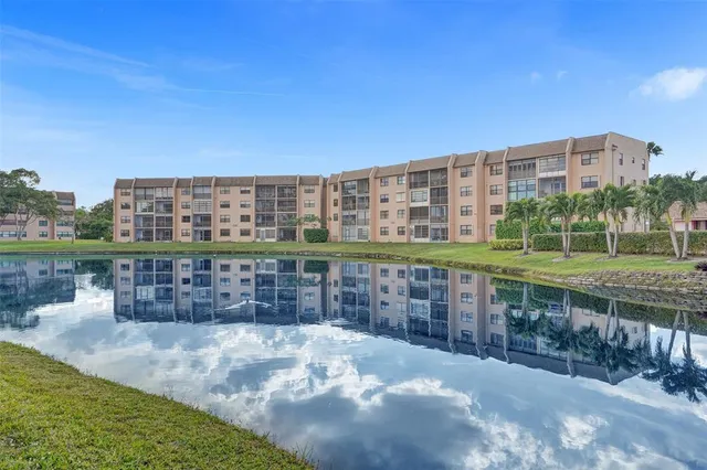a living room with lots of furniture and kitchen appliances