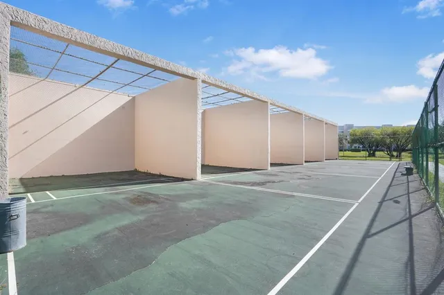 a dining room with furniture wooden floor and windows