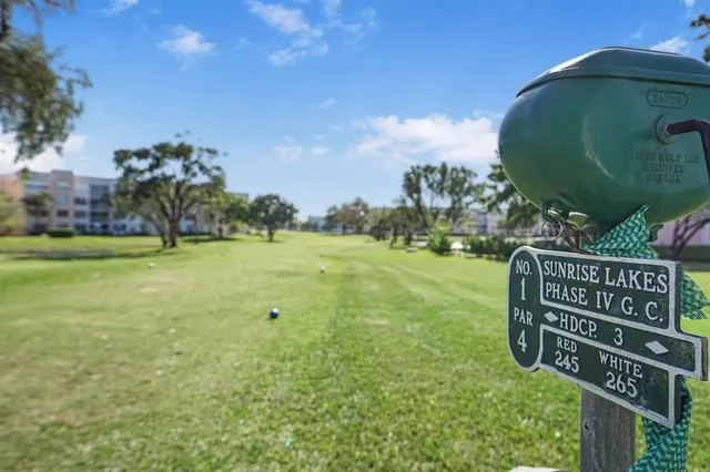 a hallway with a book shelf with books