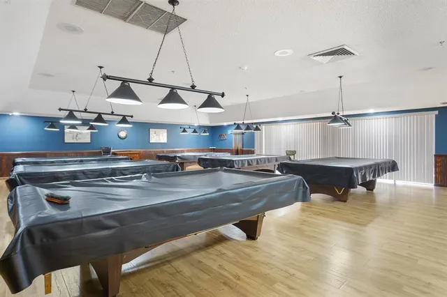 a view of a swimming pool with a lounge chair