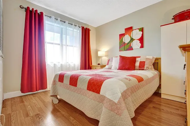 a bathroom with a painting on the wall and a shower