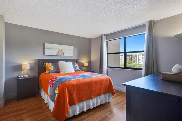 a bathroom with a toilet a sink and a mirror