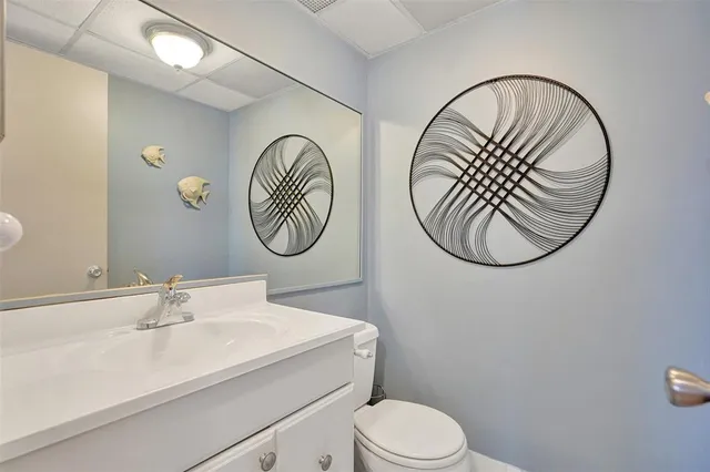 a kitchen with a refrigerator and a sink