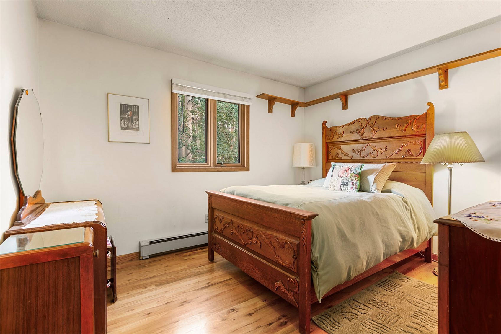 857 Deer Path Road Dillon, CO 80435 - Photo 19 of 29 a bedroom with a bed and wooden floor