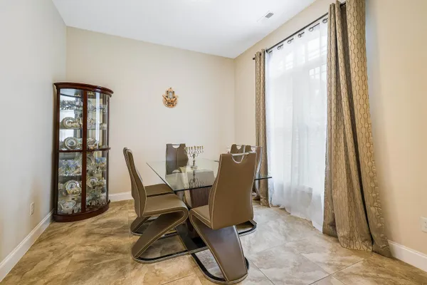 a spacious bathroom with a double vanity sink a mirror and bathtub