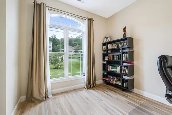a view of walk in closet with clothes