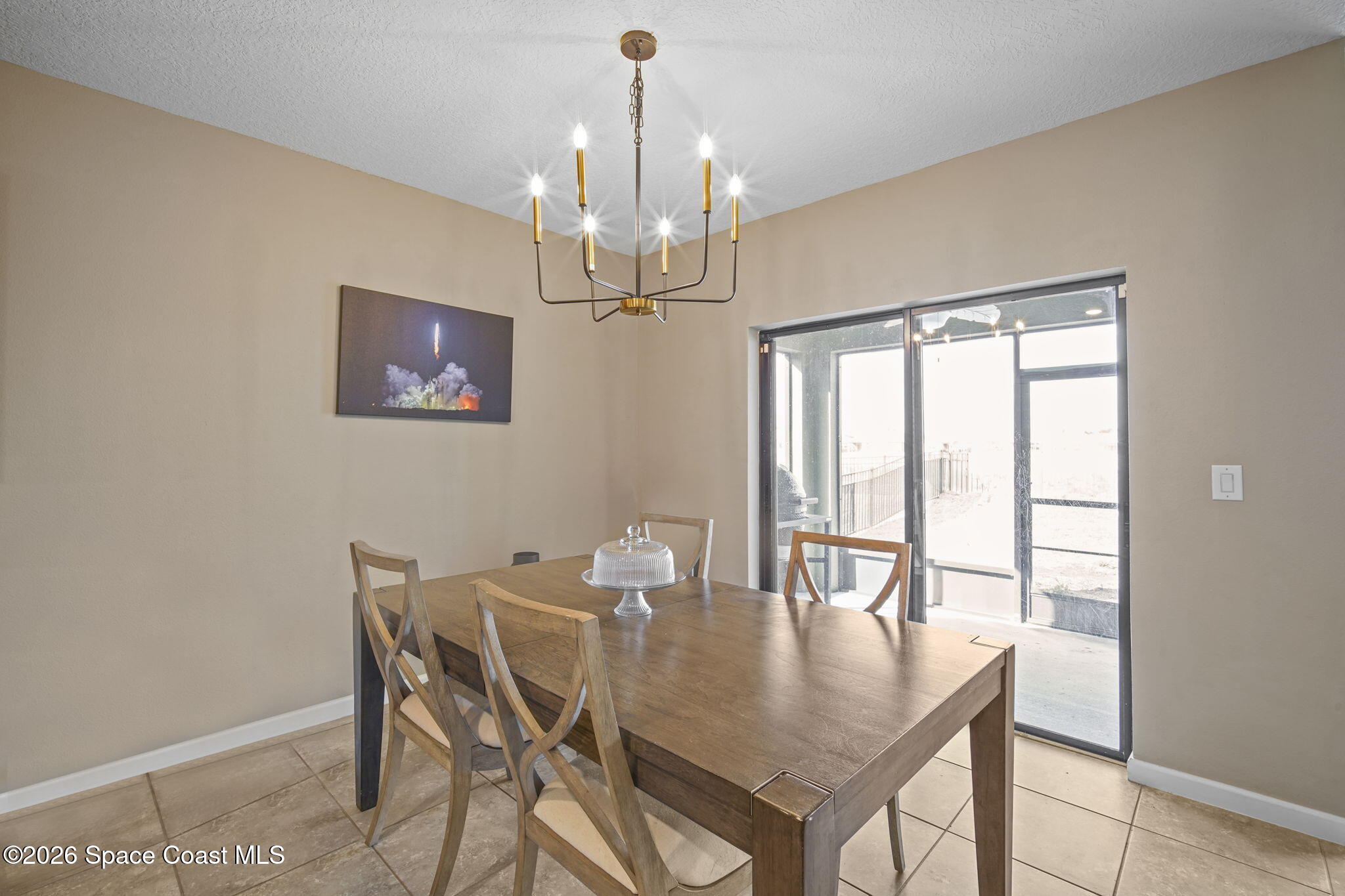 3818 Loggerhead Lane Mims, FL 32754 - Photo 12 of 30 a view of a dining room with furniture window and outside view