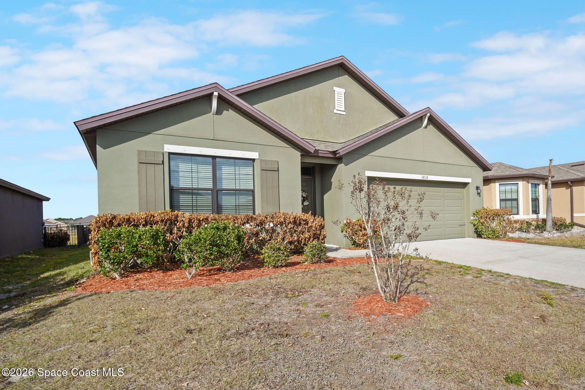 3818 Loggerhead Lane Mims, FL 32754 - Photo 2 of 30 a front view of a house with garden