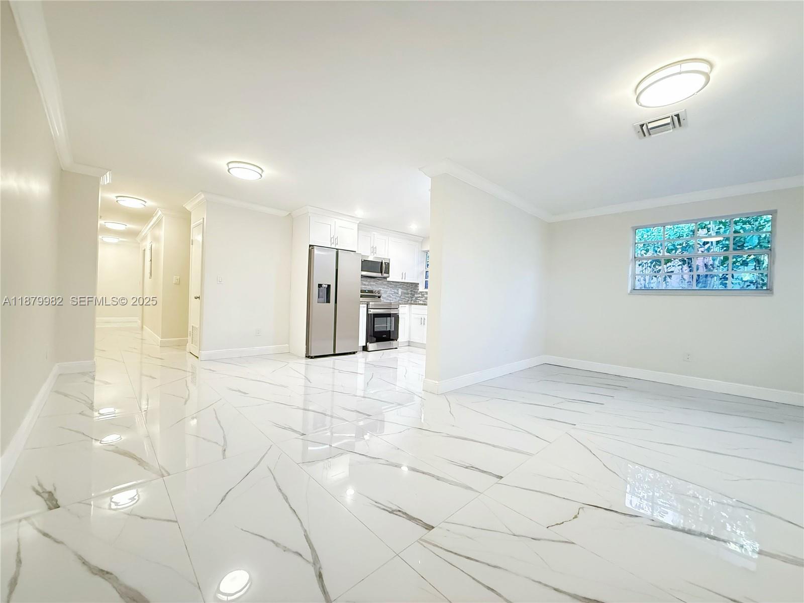 1666-1668 Southwest 9th Street Miami, FL 33135 - Photo 12 of 26 a view of an empty room with a window