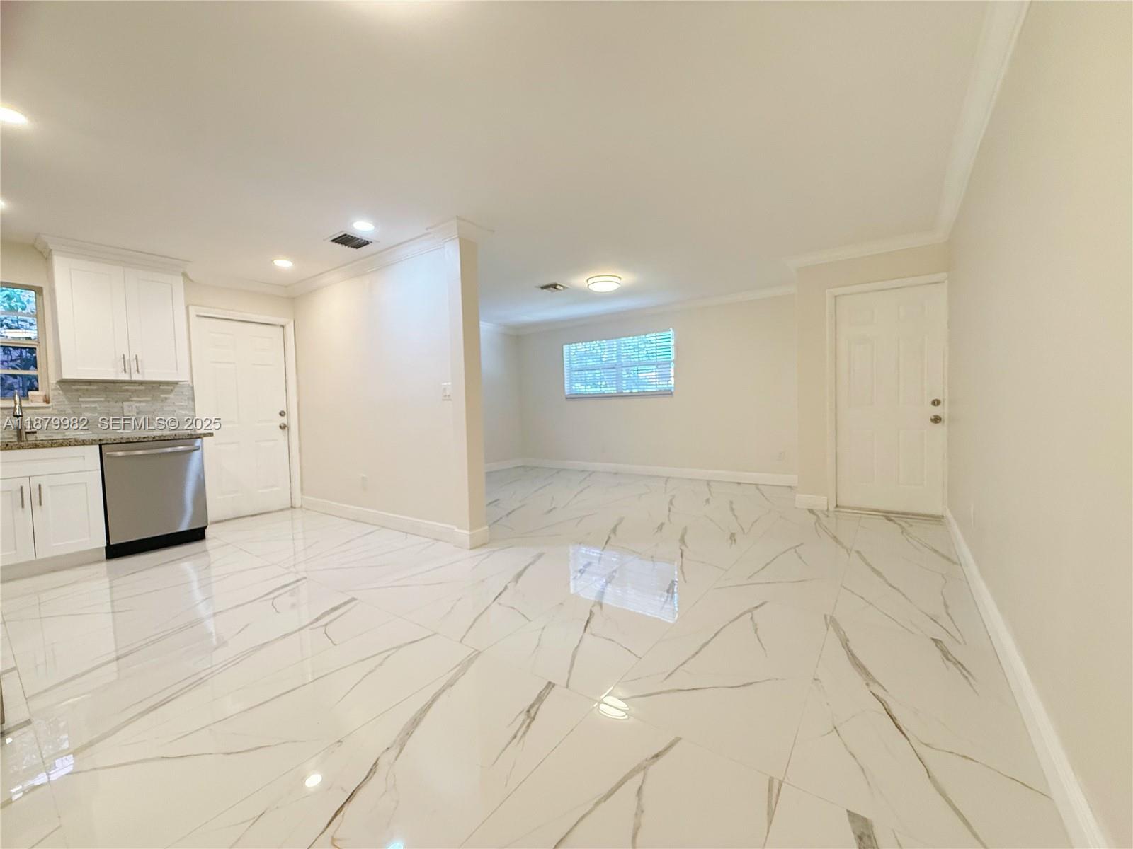 1666-1668 Southwest 9th Street Miami, FL 33135 - Photo 13 of 26 a view of a kitchen with a sink and a refrigerator