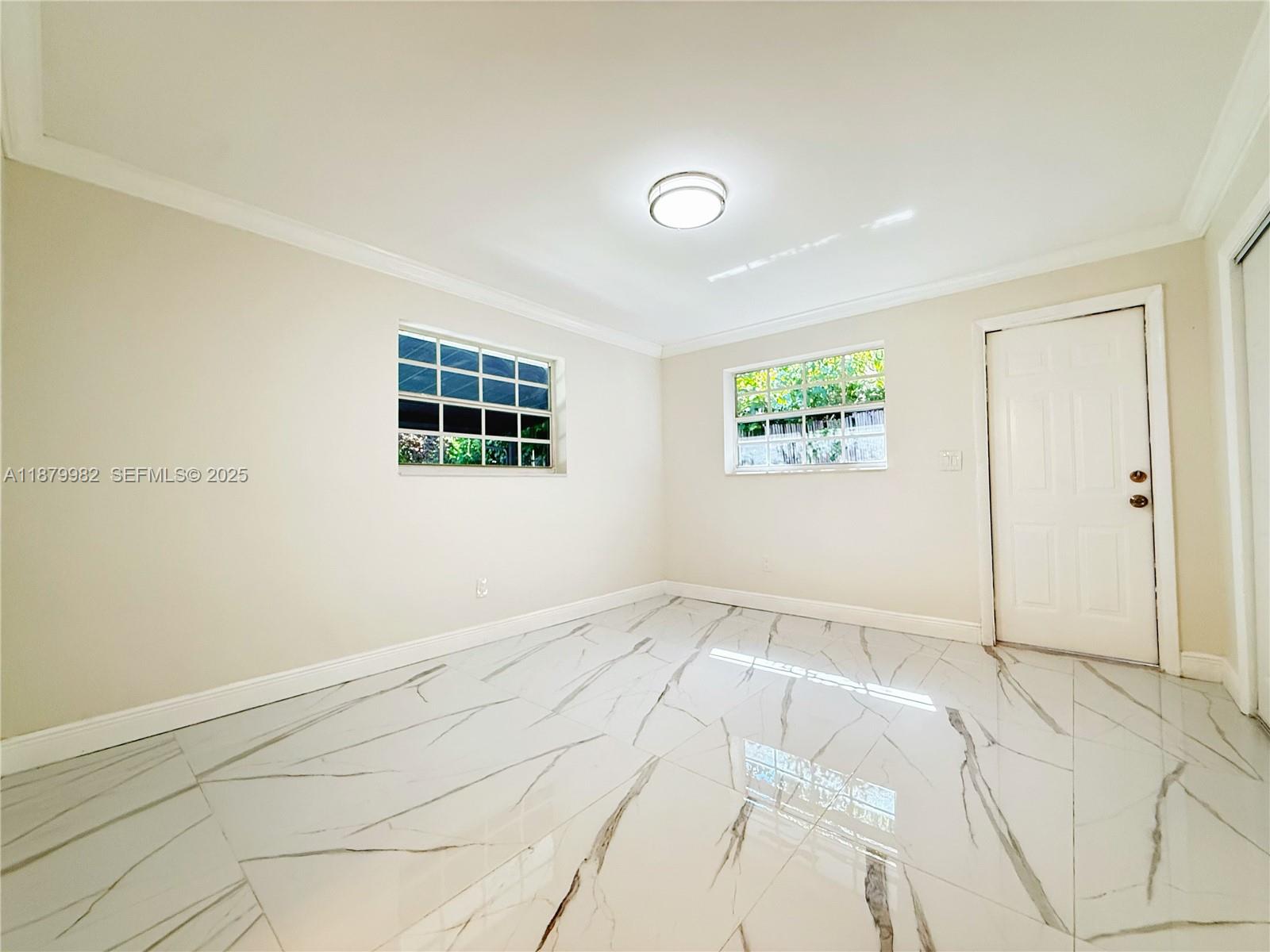 1666-1668 Southwest 9th Street Miami, FL 33135 - Photo 18 of 26 a view of an empty room with a window