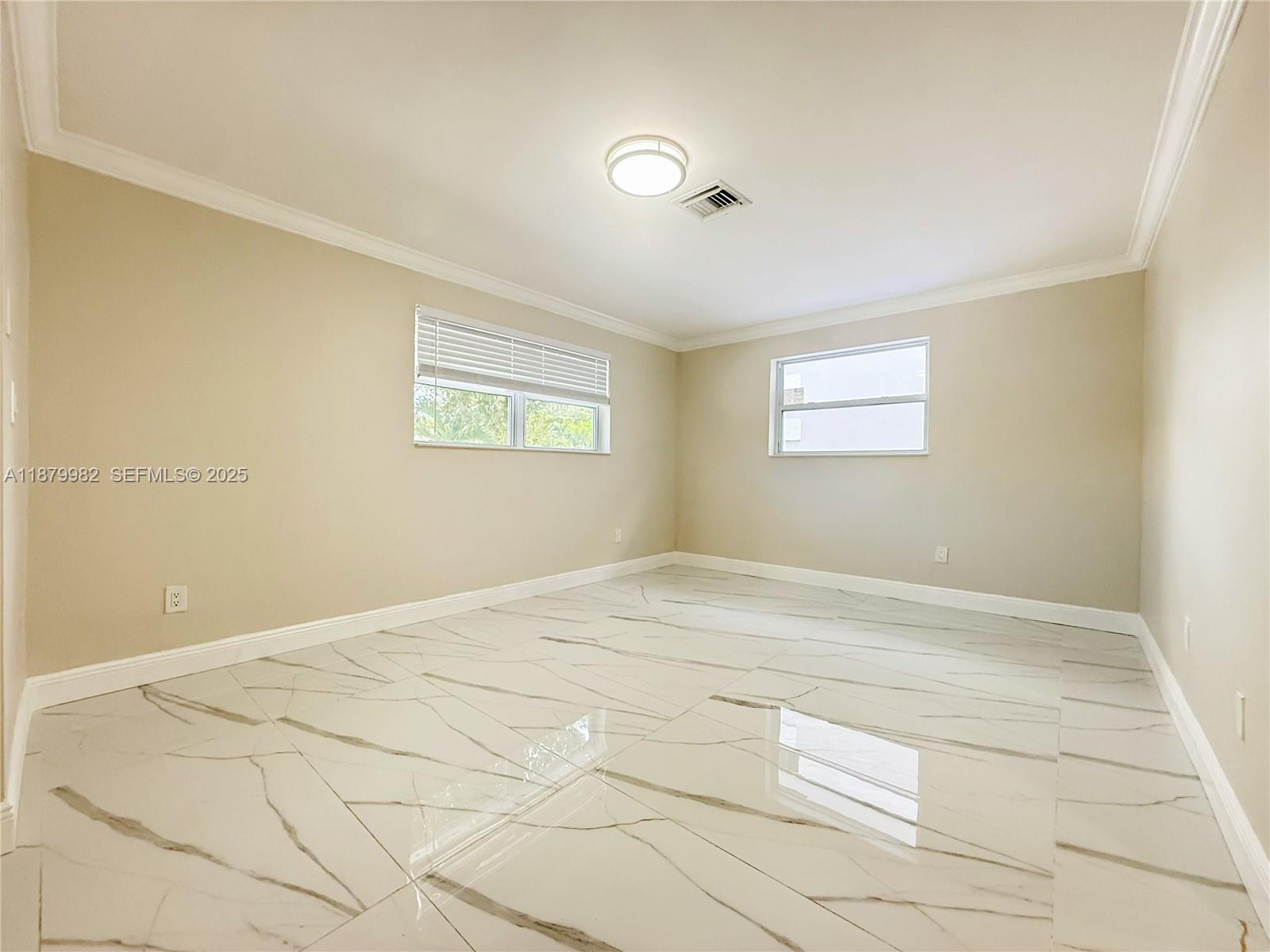 1666-1668 Southwest 9th Street Miami, FL 33135 - Photo 4 of 26 a view of empty room with windows