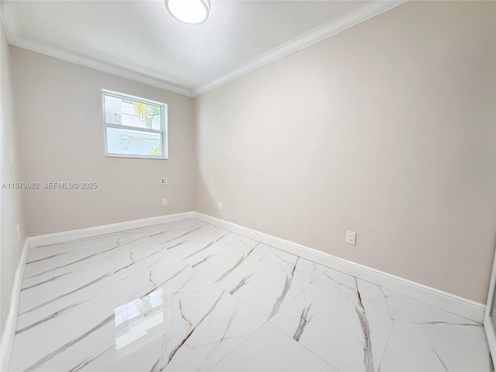 1666-1668 Southwest 9th Street Miami, FL 33135 - Photo 7 of 26 an empty room with a window