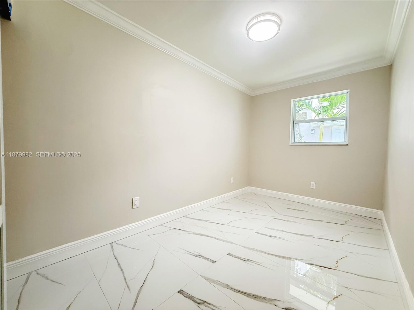 1666-1668 Southwest 9th Street Miami, FL 33135 - Photo 8 of 26 an empty room with a window