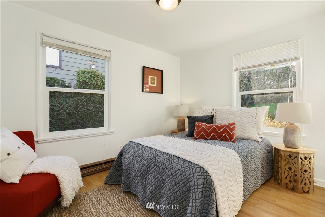3721 37th Avenue Southwest Seattle, WA 98126 - Photo 12 of 19 a bedroom with a bed and wooden floor