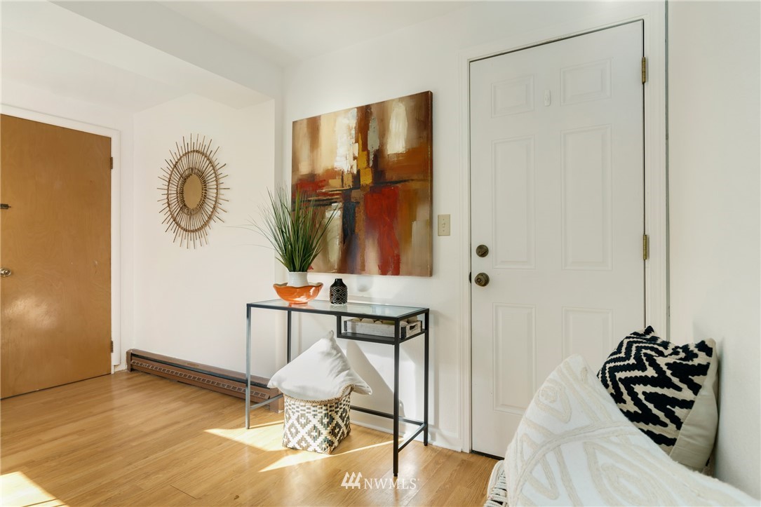 3721 37th Avenue Southwest Seattle, WA 98126 - Photo 13 of 19 a bedroom with a bed and a mirror