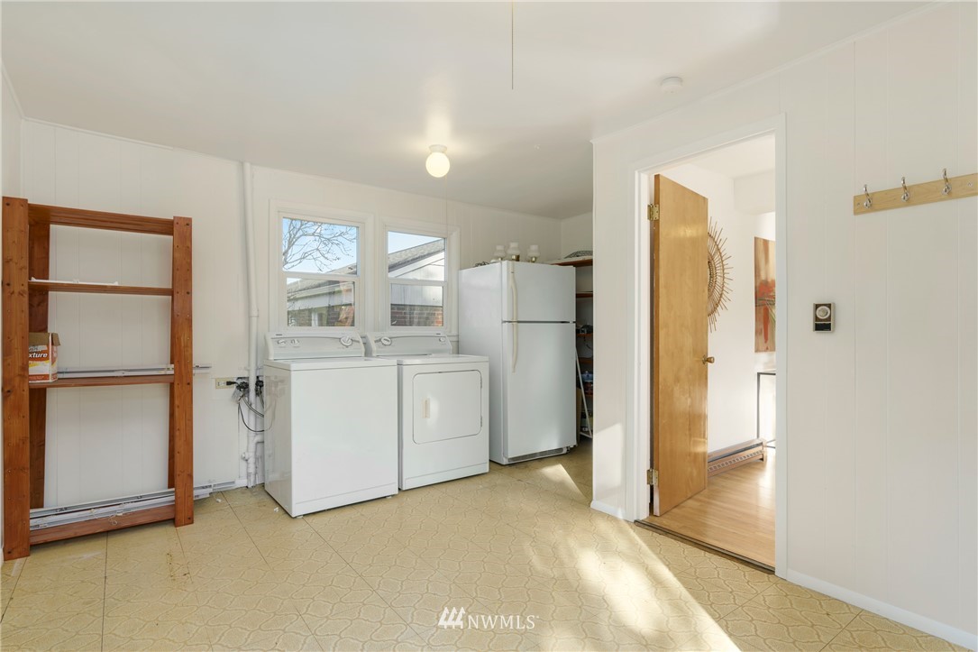 3721 37th Avenue Southwest Seattle, WA 98126 - Photo 14 of 19 a view of a kitchen with refrigerator and cabinet