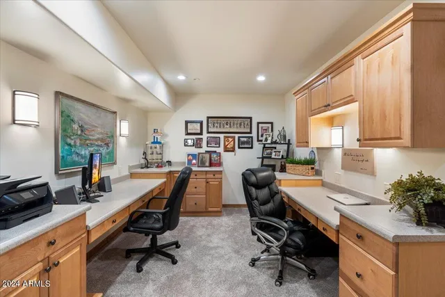 a living room with furniture a large window and a flat screen tv