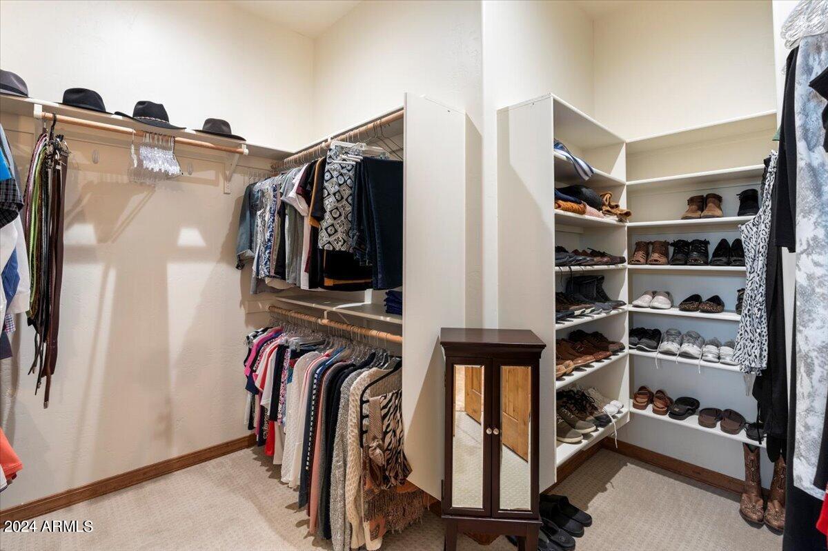 2304 East Blue Bell Circle Payson, AZ 85541 - Photo 27 of 65 a view of walk in closet with clothes and shoes