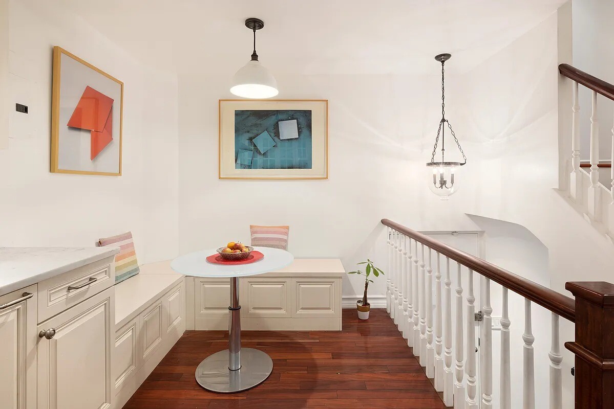 57 East 75th Street, Unit 1F Manhattan, NY 10021 - Photo 4 of 10 a dining room with furniture and wooden floor